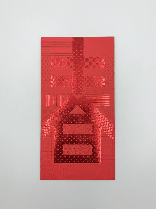 A striking red envelope showcasing an intricate use of red foil printing to create the character 'Spring' (春) with a patchwork of different glossy, geometric, and polka-dot patterns.