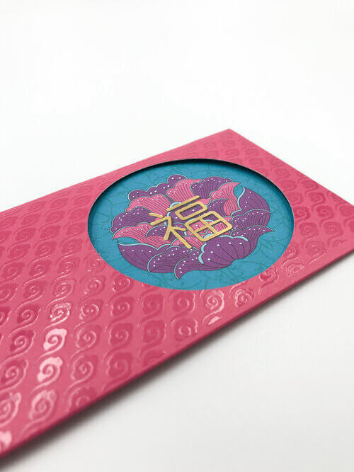 A close-up of an elegant Chinese New Year red packet with a subtle lamination for a premium finish.
