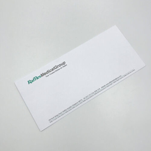 A professionally printed DL business envelope for Raffles Medical Group