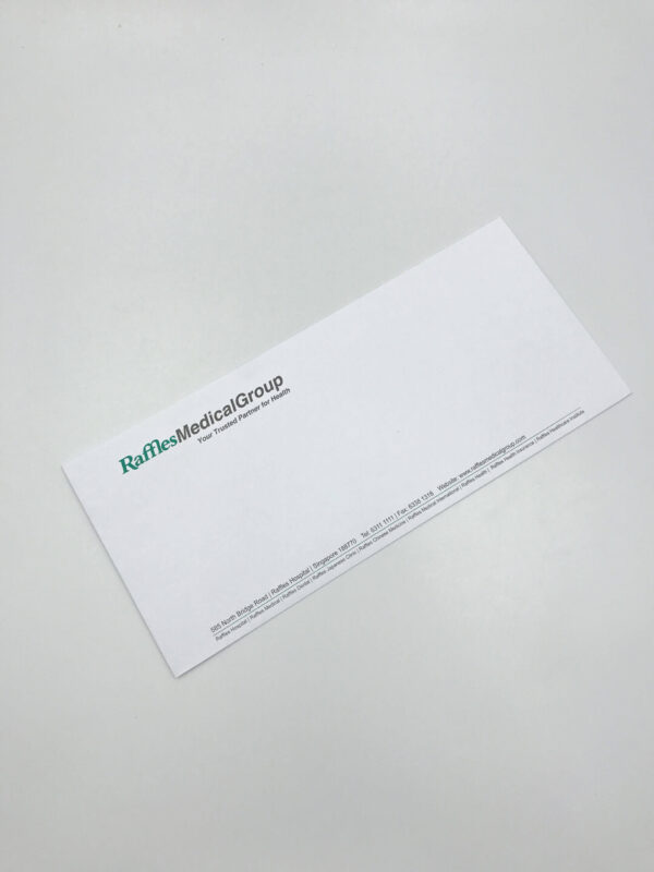 A professionally printed DL business envelope for Raffles Medical Group