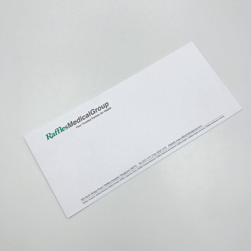 A professionally printed DL business envelope for Raffles Medical Group