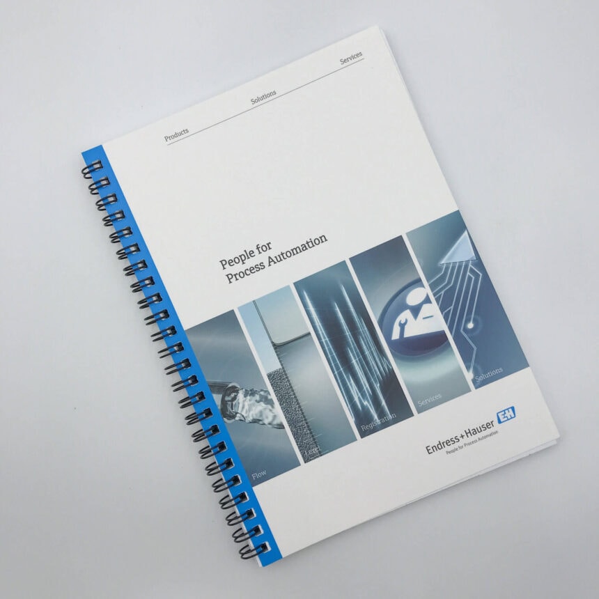 The cover of a professionally printed, spiral-bound corporate manual for Endress+Hauser, titled 'People for Process Automation', on a white background.