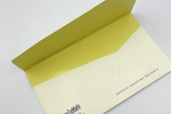 A custom-printed corporate envelope or folder for CapitaMalls Asia