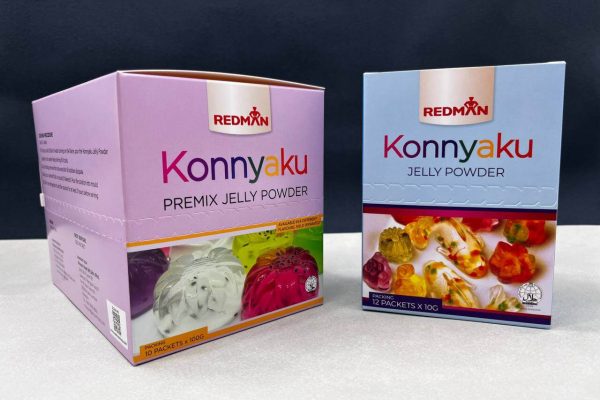 Two different custom-printed retail boxes for Redman's Konnyaku Jelly Powder, a larger pink premix box and a smaller blue box, showcasing effective product packaging design