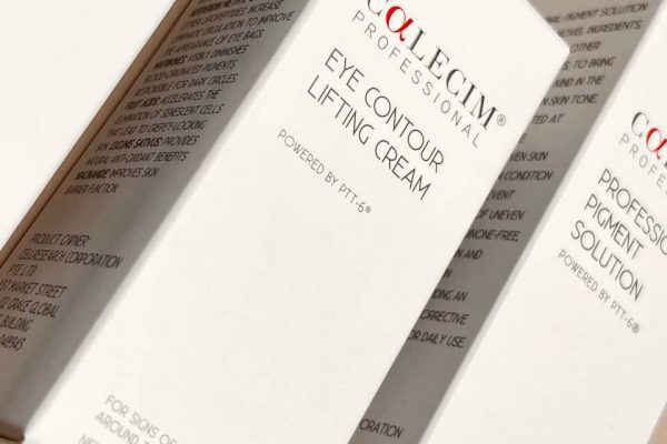 A close-up of several professionally printed white boxes for Calecim Professional skincare products, showcasing a clean and minimalist packaging design for creams and solutions